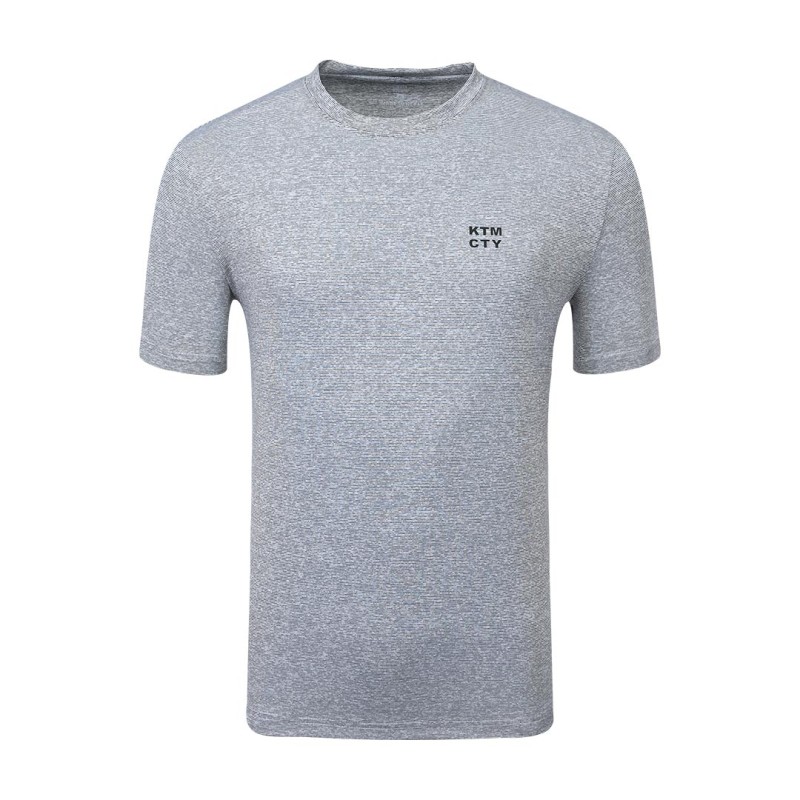 A male model wearing a dark grey heathered KTM CTY Altitude Wear short-sleeve t-shirt featuring a small white logo on the left chest 1