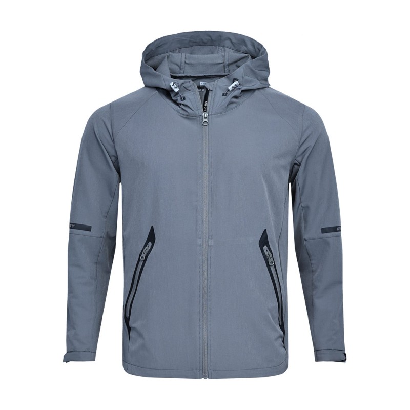 A solid grey KTM CTY Metro Shift Windbreaker jacket featuring a full front zipper, an adjustable hood, and contrasting black zippered side pockets for a sleek, modern look. 0