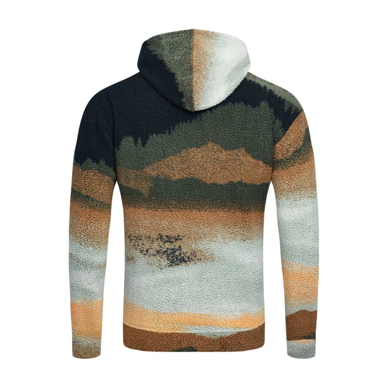 Model styling the KTM CTY Oversize Emberprint Sherpa Hoodie, featuring a warm, textured fleece with an earthy brown, green, and cream abstract pattern, oversized fit, with her hands in the front kangaroo pocket 5