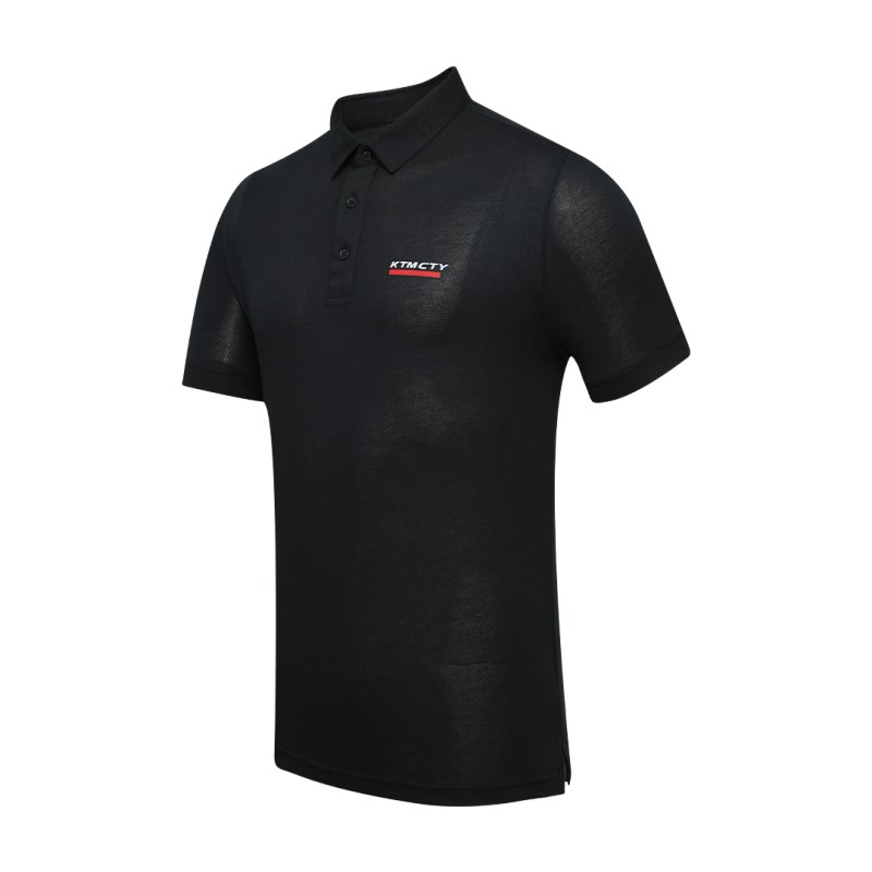 A man styling the forest green KTM CTY Pulse athletic polo tshirt, featuring a classic buttoned collar and short sleeves, paired comfortably with casual grey trousers 0
