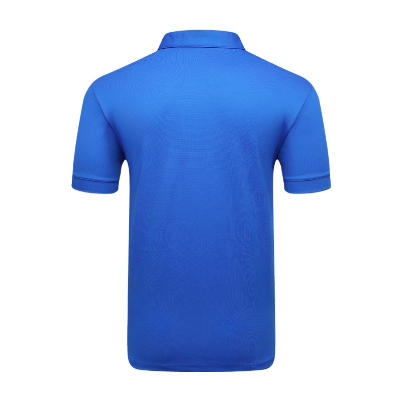 A man styling the forest green KTM CTY Pulse athletic polo tshirt, featuring a classic buttoned collar and short sleeves, paired comfortably with casual grey trousers 3