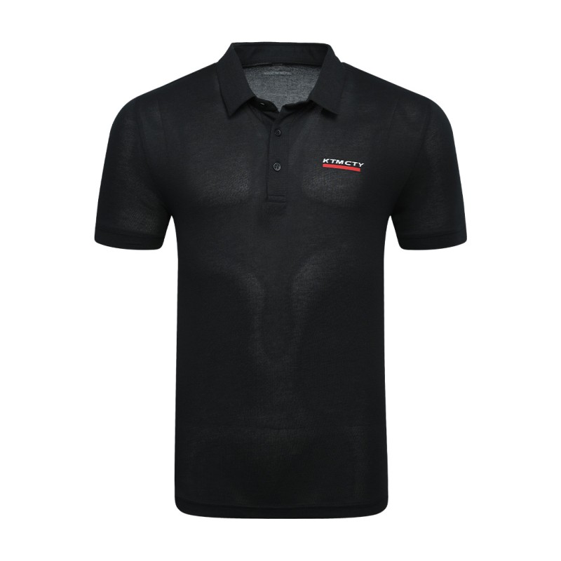 A man styling the forest green KTM CTY Pulse athletic polo tshirt, featuring a classic buttoned collar and short sleeves, paired comfortably with casual grey trousers 0