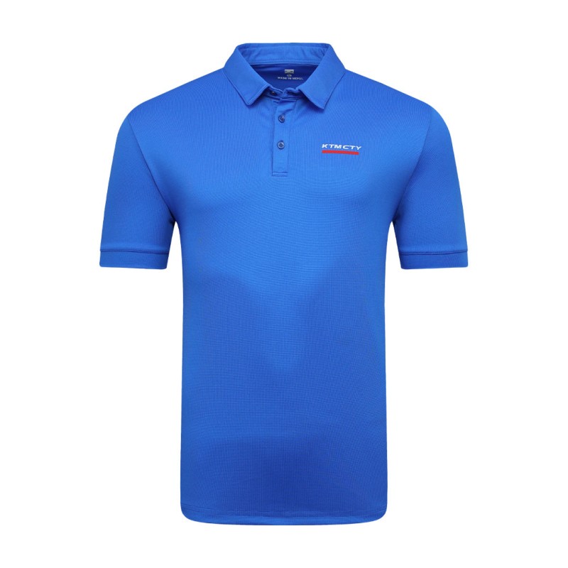 A man styling the forest green KTM CTY Pulse athletic polo tshirt, featuring a classic buttoned collar and short sleeves, paired comfortably with casual grey trousers 1
