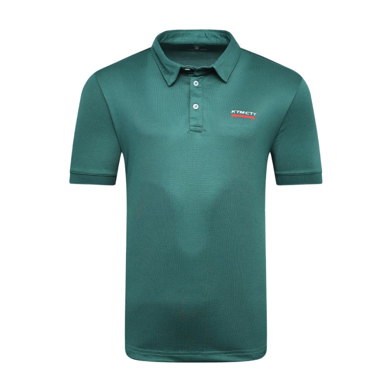 A man styling the forest green KTM CTY Pulse athletic polo tshirt, featuring a classic buttoned collar and short sleeves, paired comfortably with casual grey trousers 2