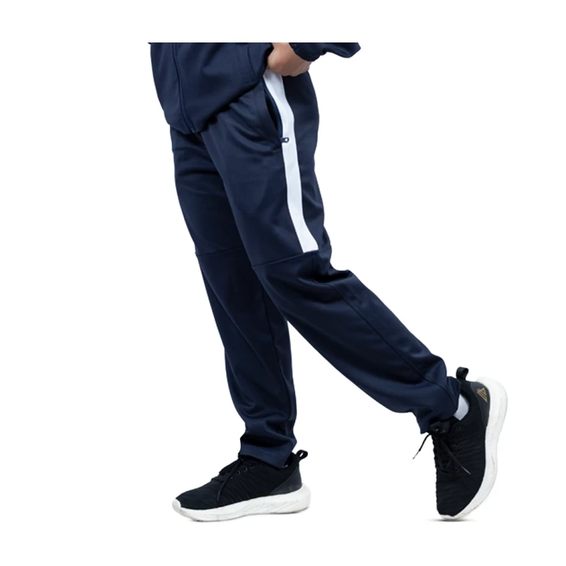 close-up of a person wearing black KTM CTY Strike Track Trousers featuring a bold white side stripe on the upper leg 2