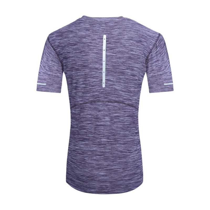 A female model posing with hands on her hips, wearing a purple heathered short-sleeve athletic KTM Luna Wear Crop T-Shirt featuring black horizontal line accents across the chest and sleeves, paired with grey activewear bottoms 1