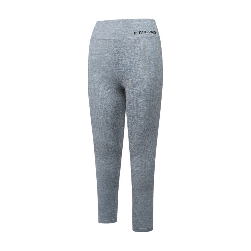 KTM PRO mint green high waisted leggings worn by female model during workout or at gym paired with black crop top and sneakers on white background 6