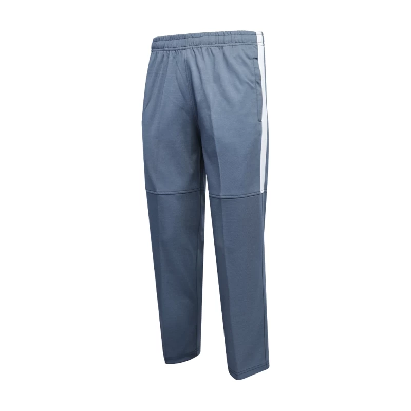 A side-profile view of a person wearing black KTM CTY Strike track pants. The trousers feature a bold white stripe down the upper side of the leg and a horizontal articulated knee seam 1