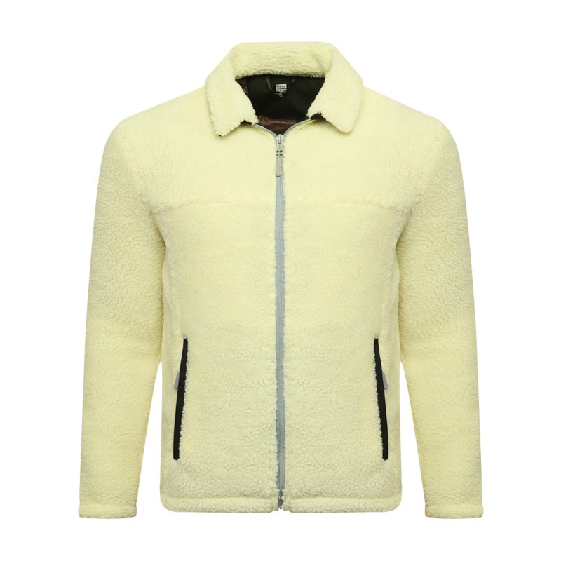 A model wearing a cream-colored sheep polyfiber unisex winter jacket featuring a classic fold-down collar, a full front zipper and hands resting in the side pockets 1