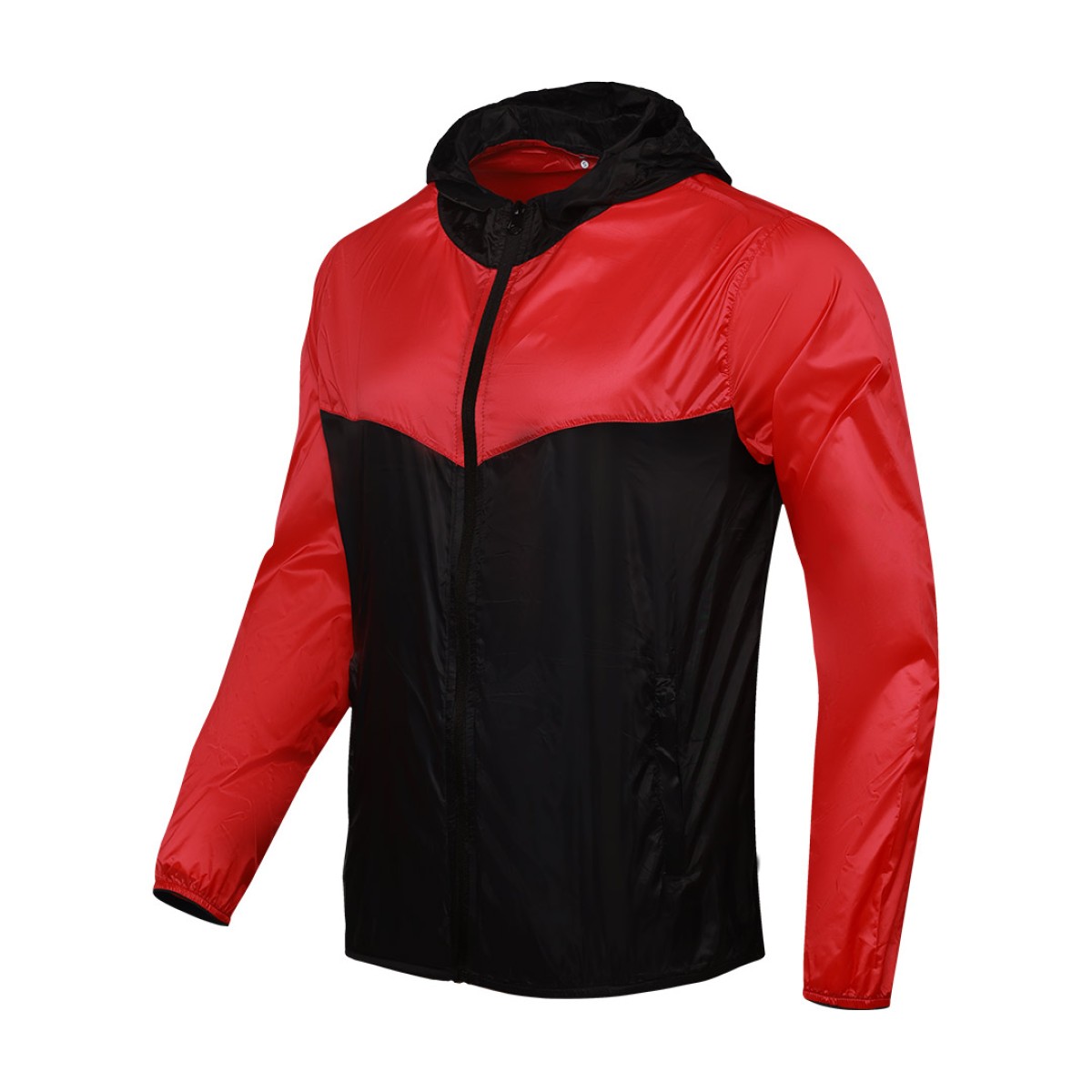 Front view of a male model styling a vibrant red and blue color-block lightweight windcheater jacket. This casual Unisex Windbreaker Jacket features a full zipper and a protective hood, making it a great outer layer for summer wear jacket. 4