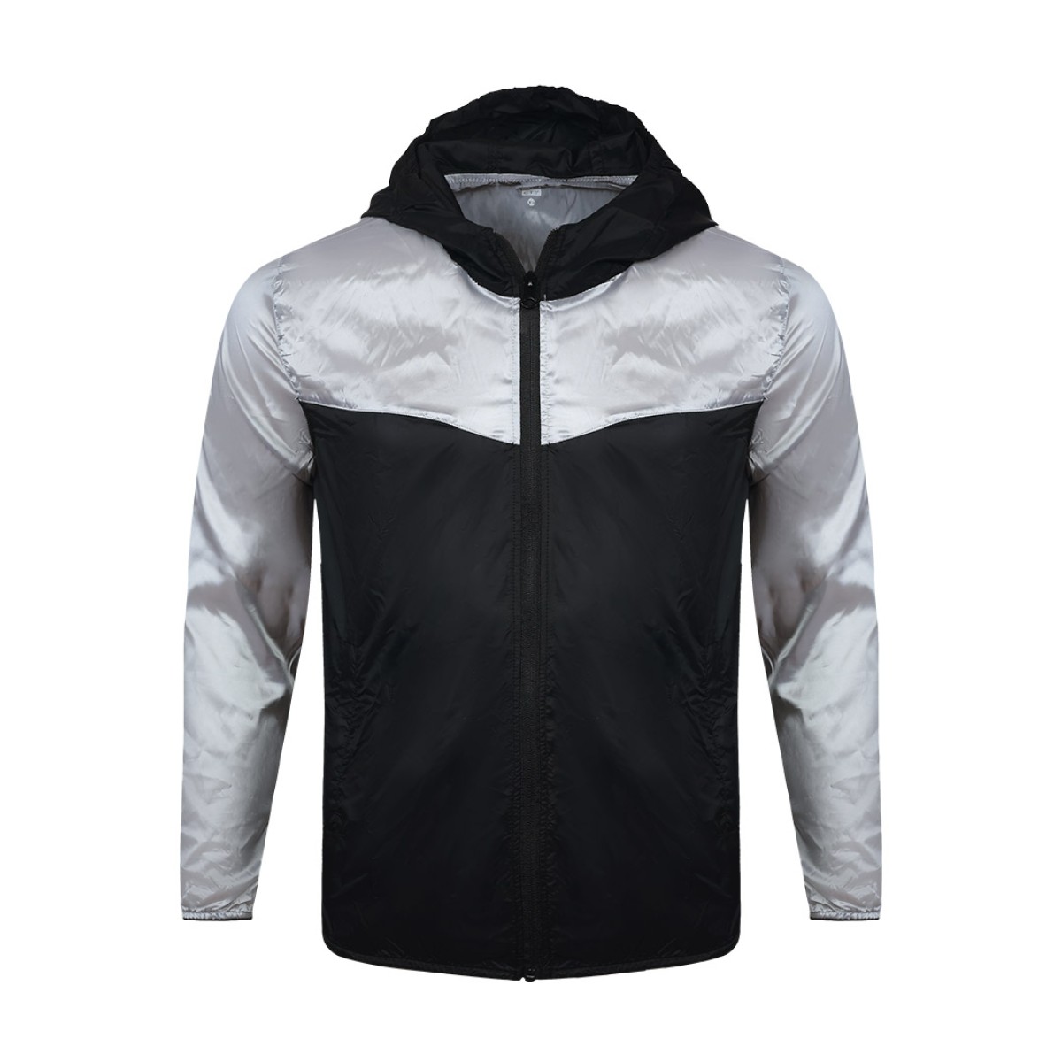 Front view of a male model styling a vibrant red and blue color-block lightweight windcheater jacket. This casual Unisex Windbreaker Jacket features a full zipper and a protective hood, making it a great outer layer for summer wear jacket. 3