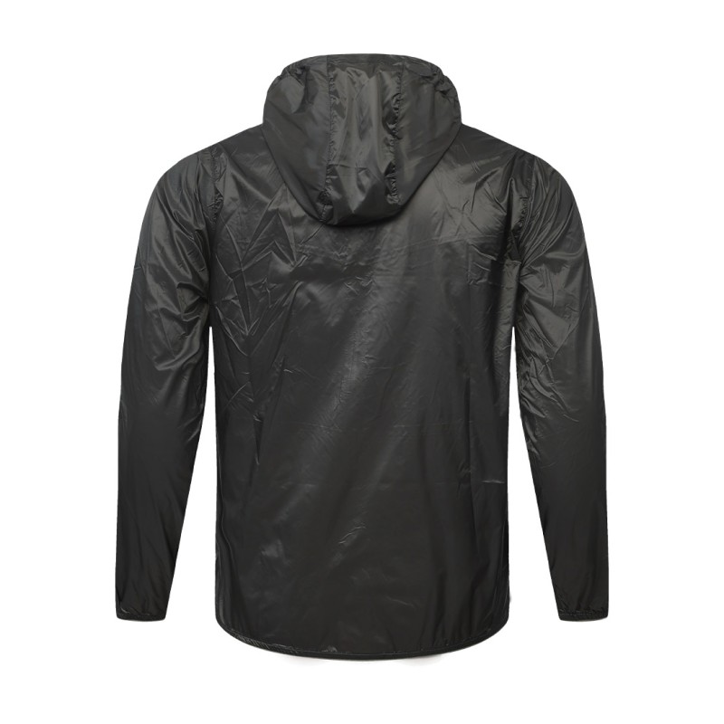 A male model adjusting the zipper of the lightweight, solid red Velocity Breeze Windcheater Jacket with hoodie, featuring a hood and a contrasting black front zipper 5